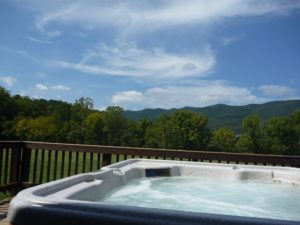 Hot tub view from River log cabin rentals near Luray VA
